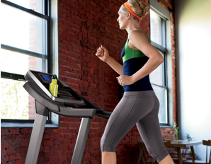 Person in sweats on treadmill